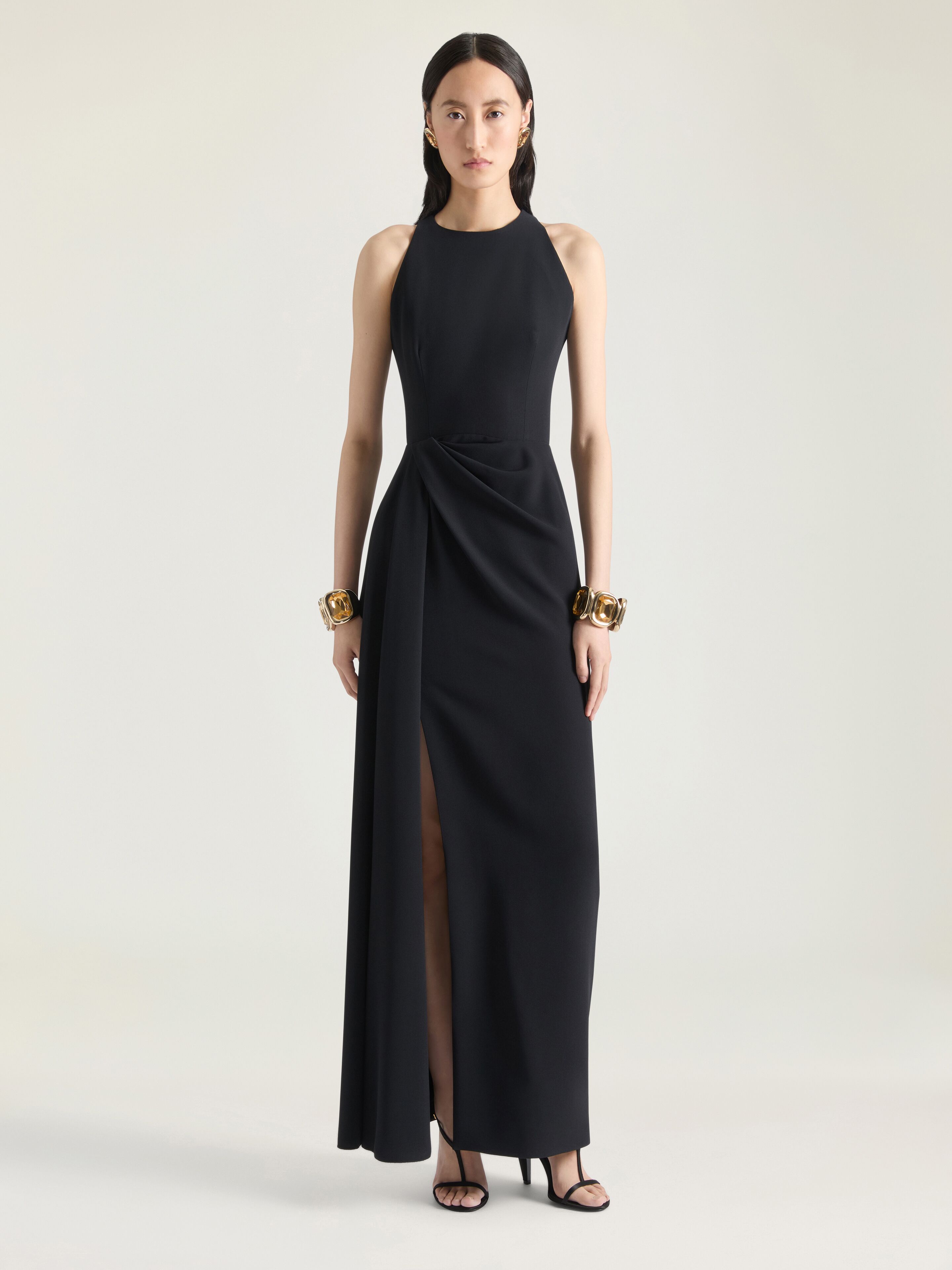 Draped halterneck evening dress in crepe cady